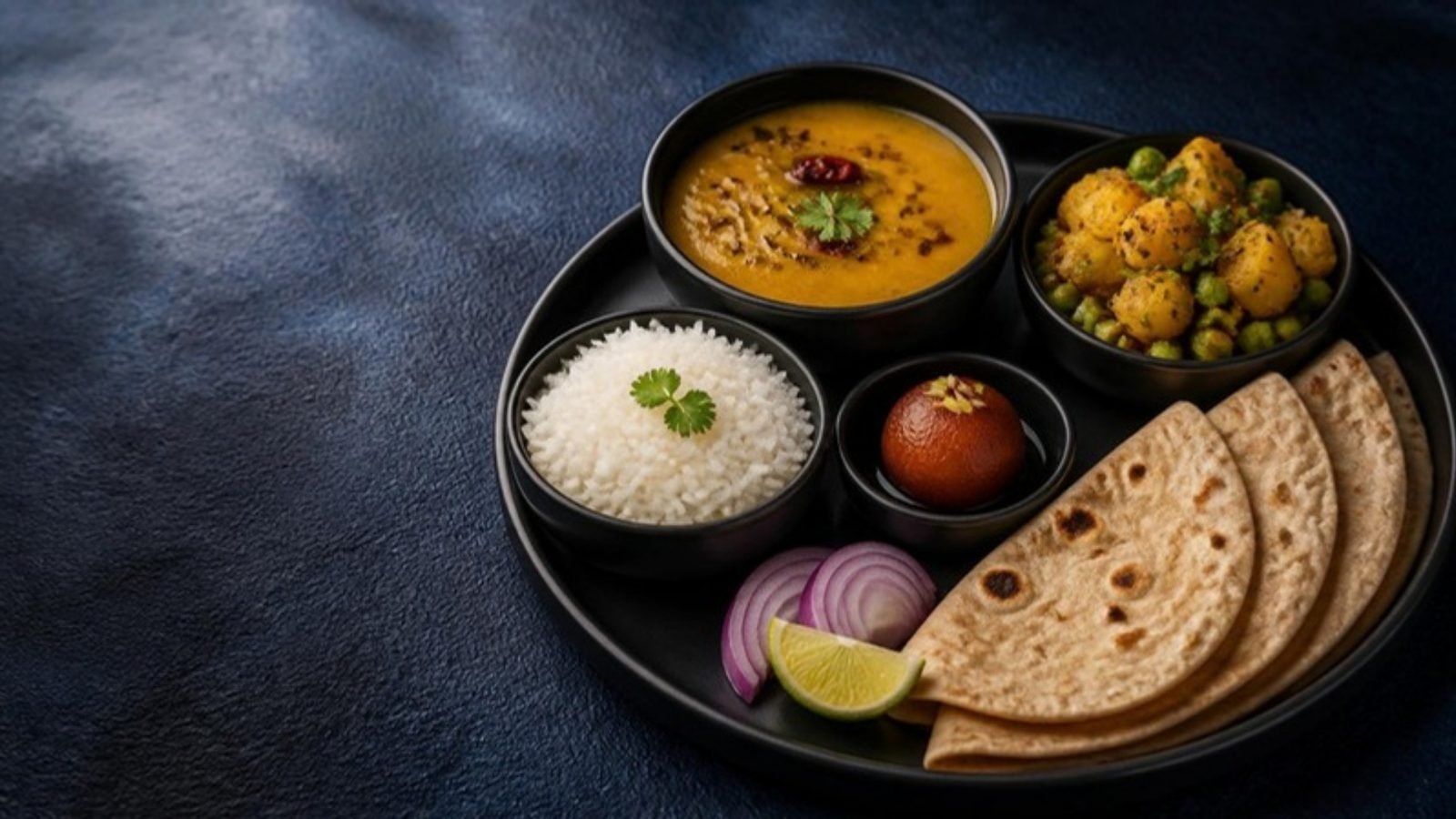 Lunch Thali: dal, rice, three roti, subji and a sweet